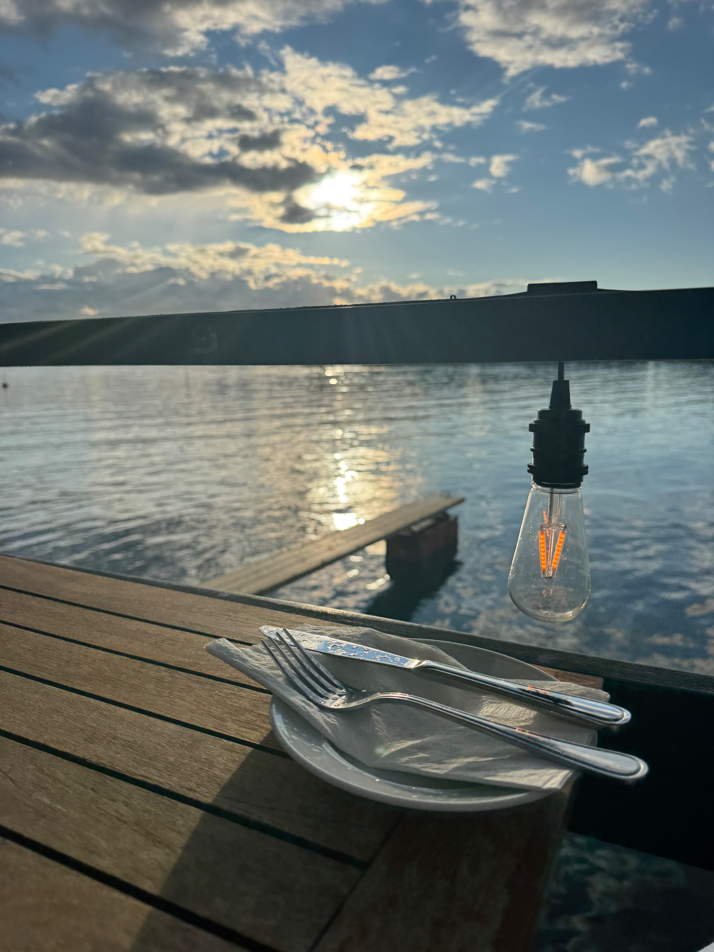 Sunset over the water with candlelight